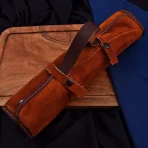 Materials: Aluminium, copper, iron, steel, wood This handcrafted 3-piece knife set features beautifully engraved Damascus-style blades and unique wooden handles with blue inlay accents. Perfect for chefs who value both artistry and performance. Includes a stylish leather carrying case. - Image 8